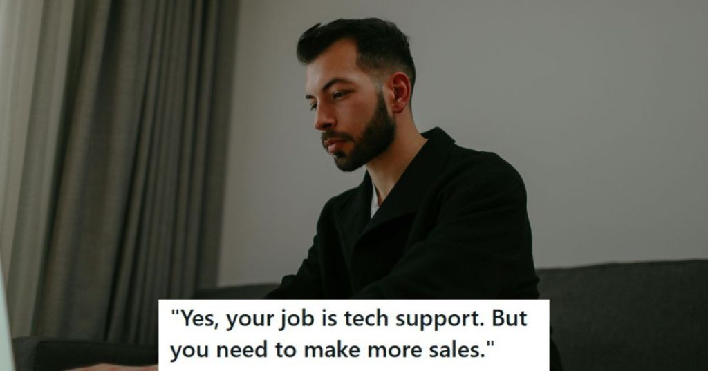 Man in black shirt working on his laptop