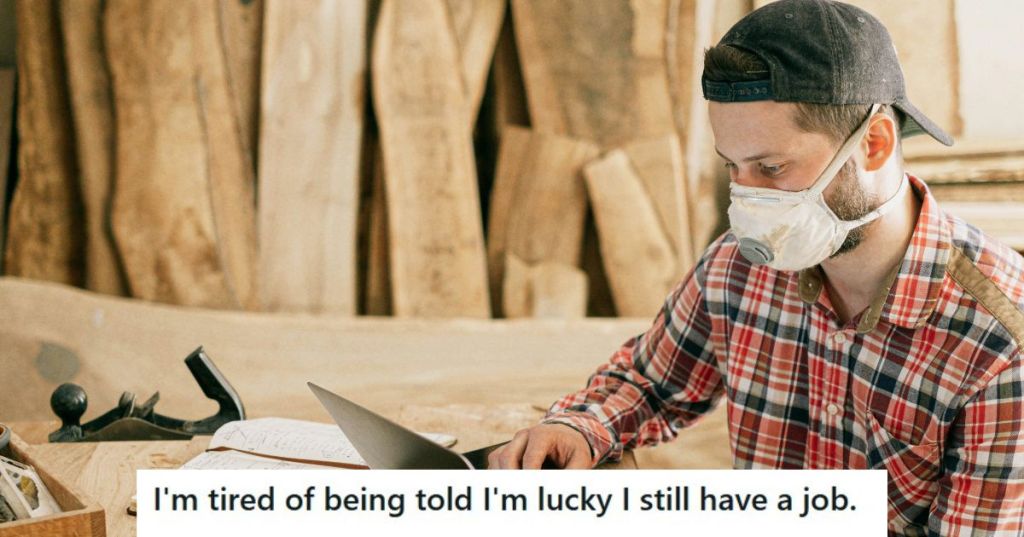 Man in checkered shirt working