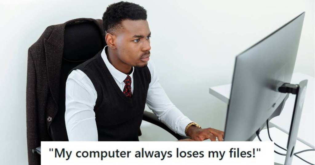 man in suit working on his computer
