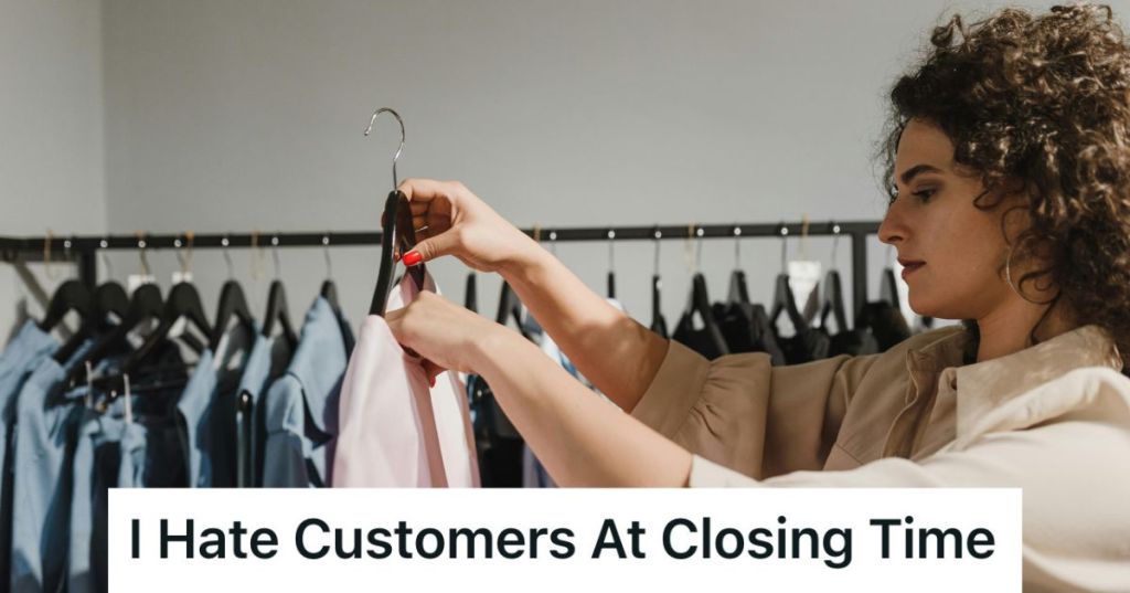 Woman hanging clothes in a retail store