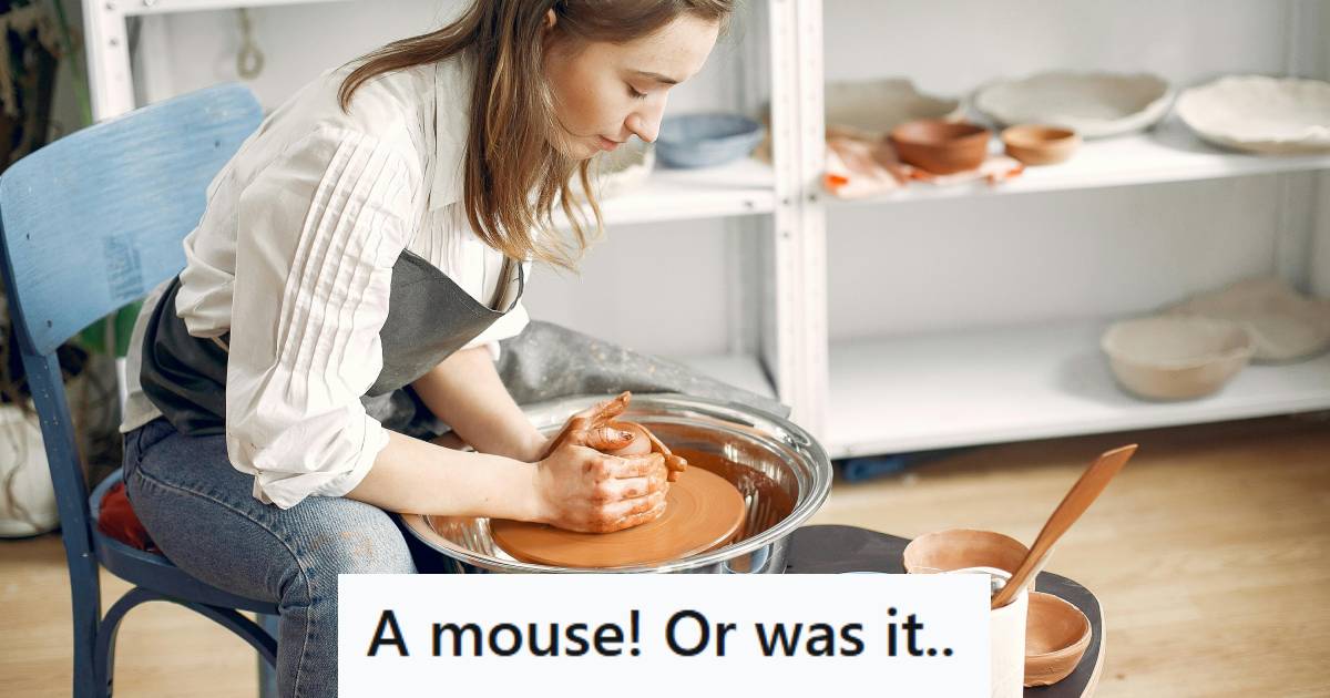 Woman creating a piece of pottery in her studio