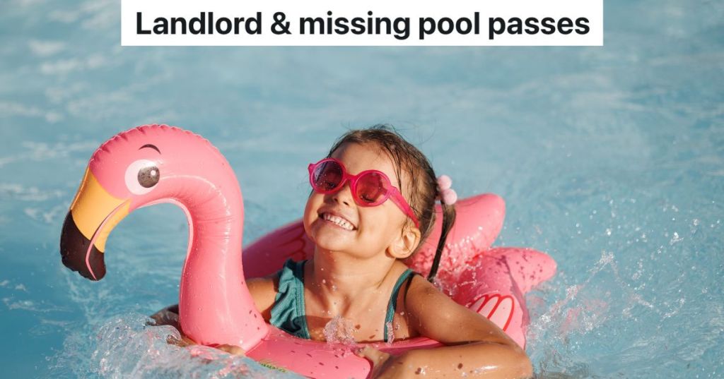 toddler girl in pink flamingo pool float in swimming pool