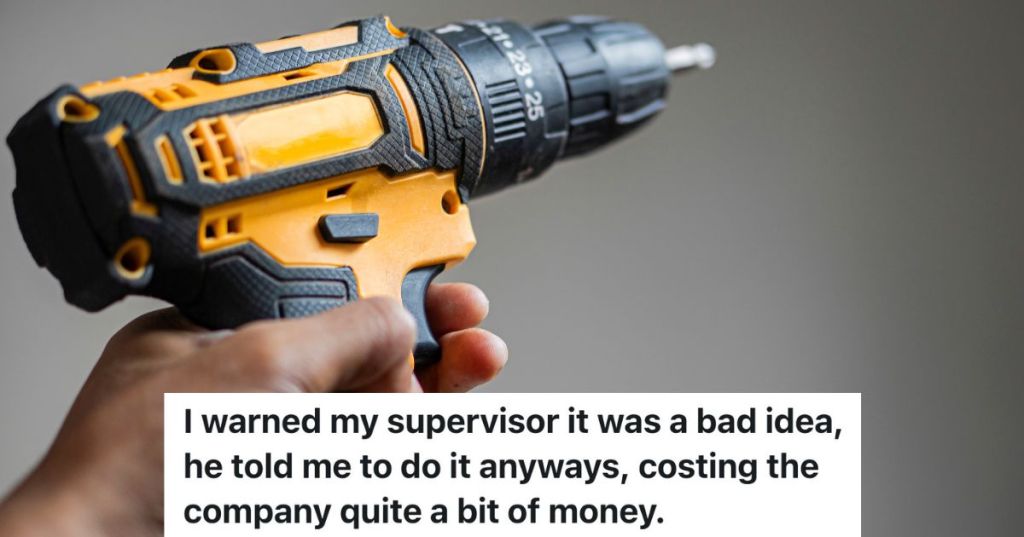 closeup of hand holding yellow and black electric drill