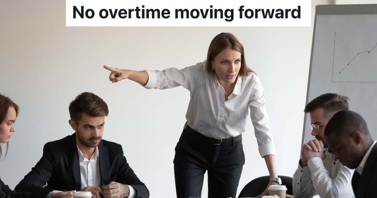 angry business woman yelling at employees in meeting