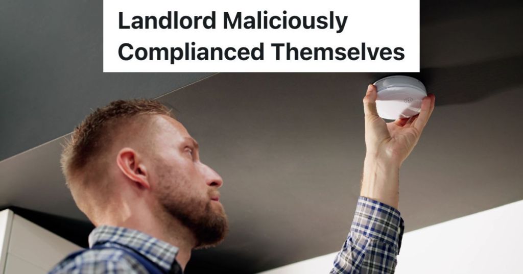 man installing smoke detector fire alarm on ceiling