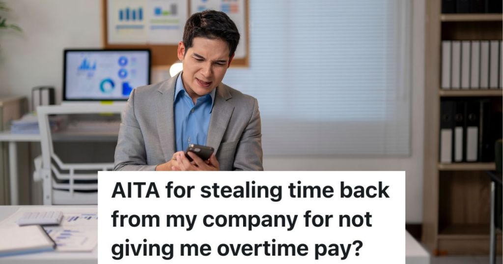 man in a suit looking at his phone at work