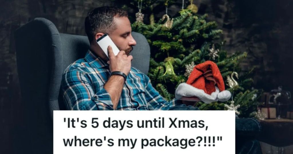man sitting next to a Christmas tree talking on the phone