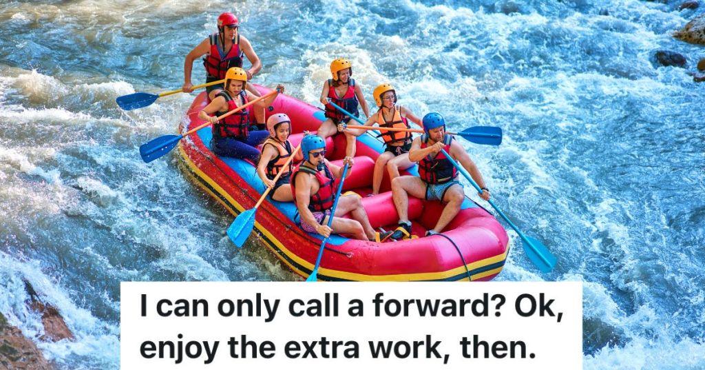 group of people river rafting in a red raft