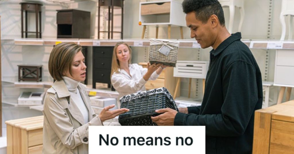 Woman talking to a store employee about a product