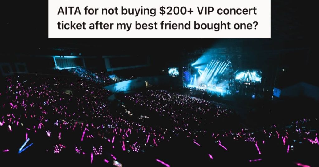 A dark concert venue with lights and audience