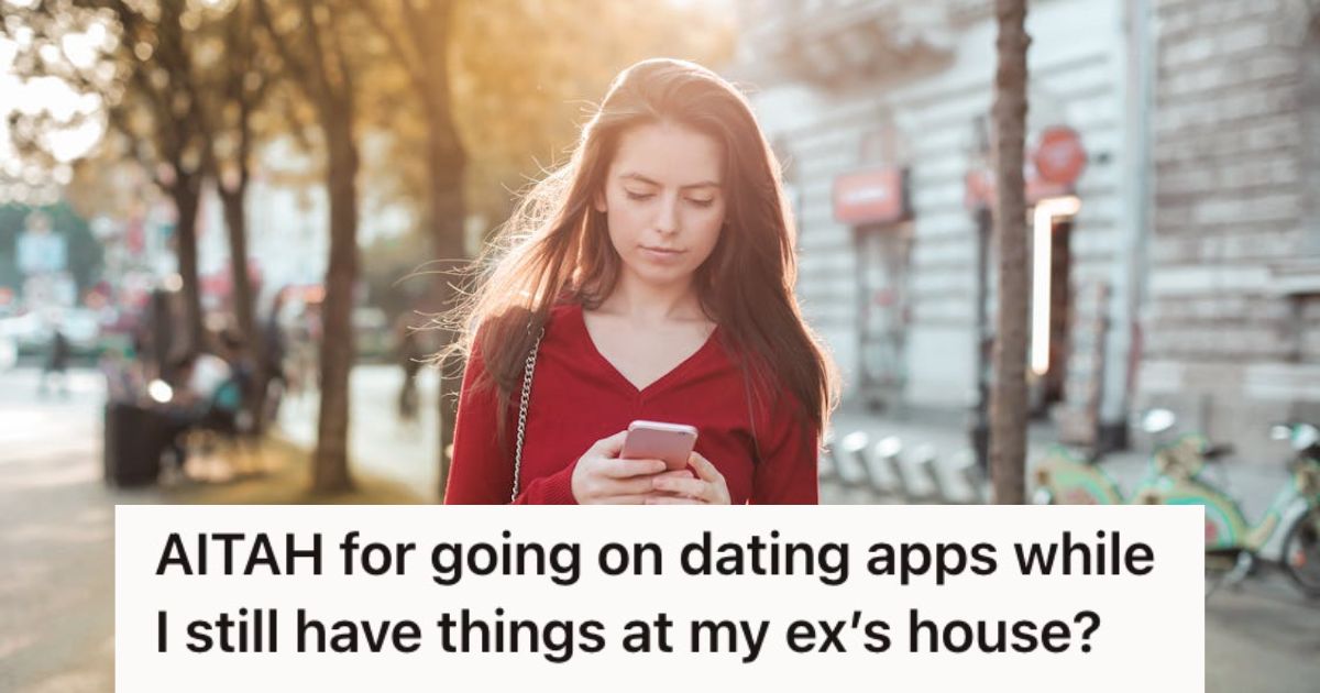 Woman looking at her phone while walking outside