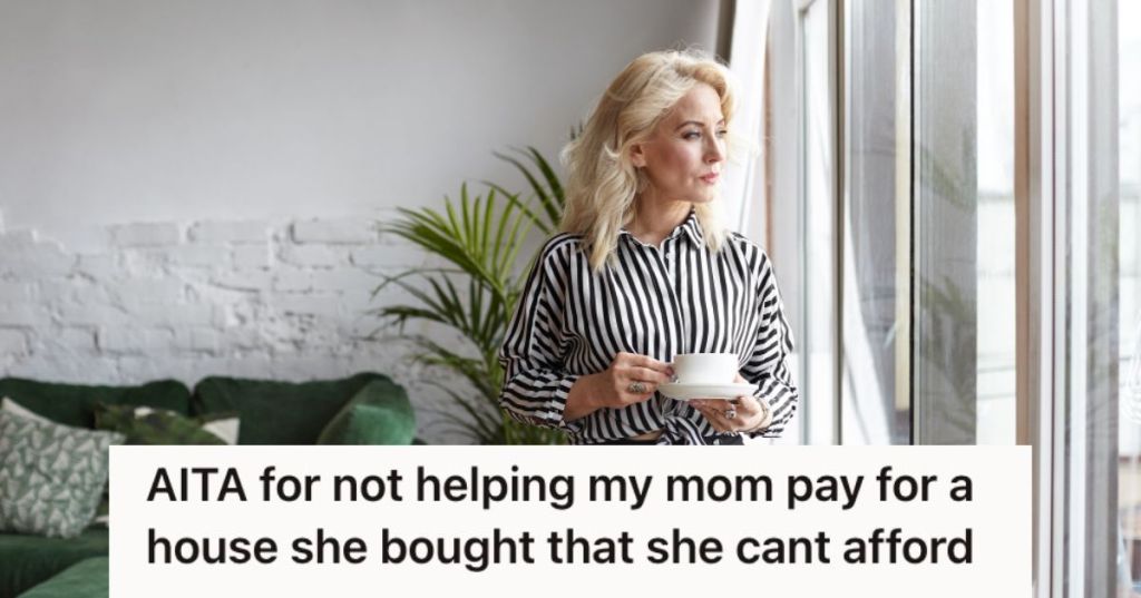 Woman having coffee while looking out the window
