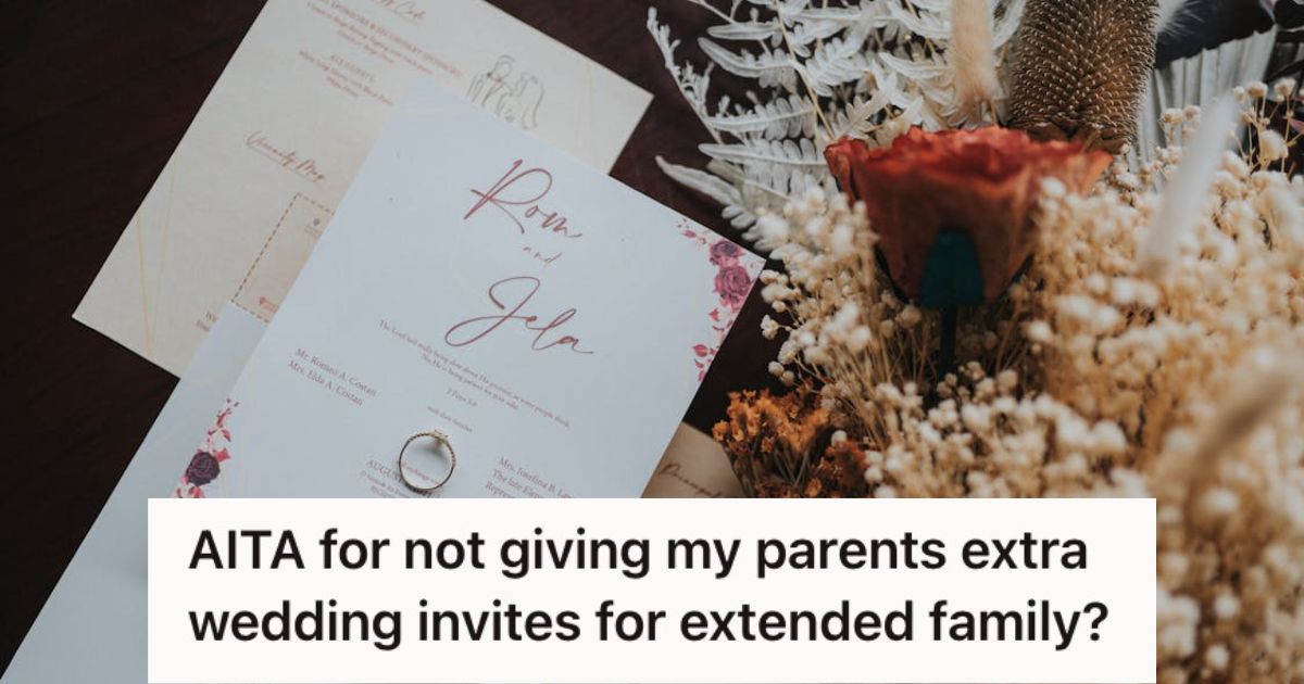A few pages of wedding invitation on a table with flowers