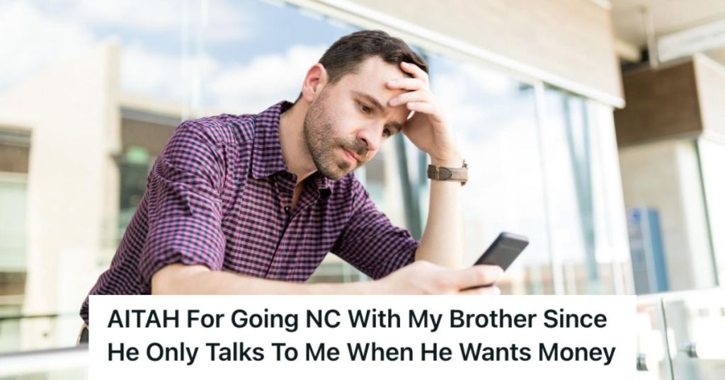 Man looking at his phone and feeling upset