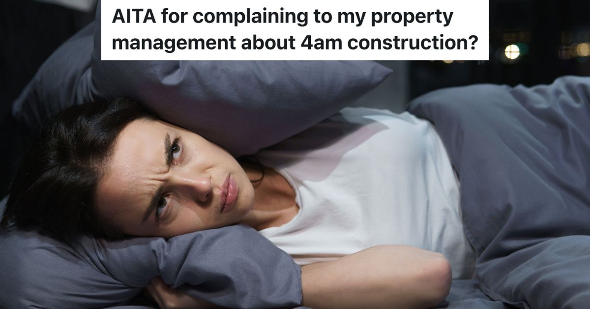 woman covering ears with pillow trying to sleep through noise