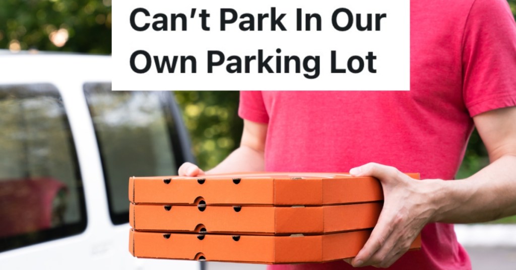 man holding three pizza boxes