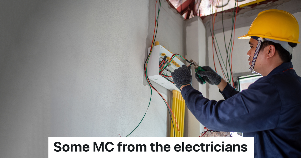 electrician in yellow hardhat working inside house
