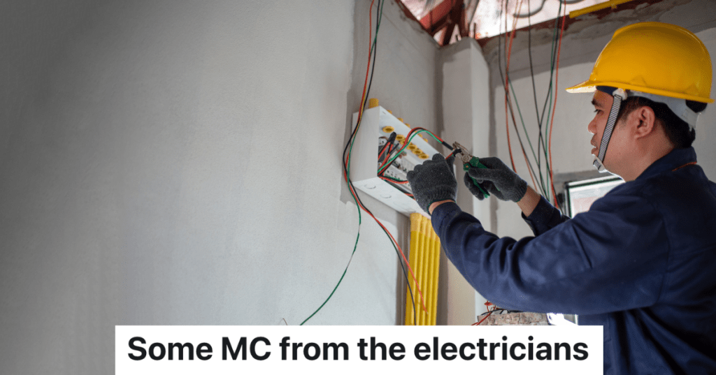 electrician in yellow hardhat working inside house