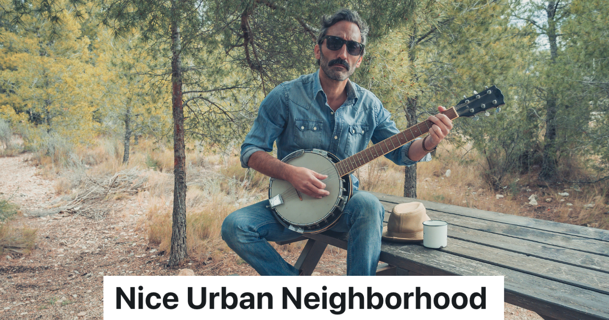 man sitting on a bench with a banjo