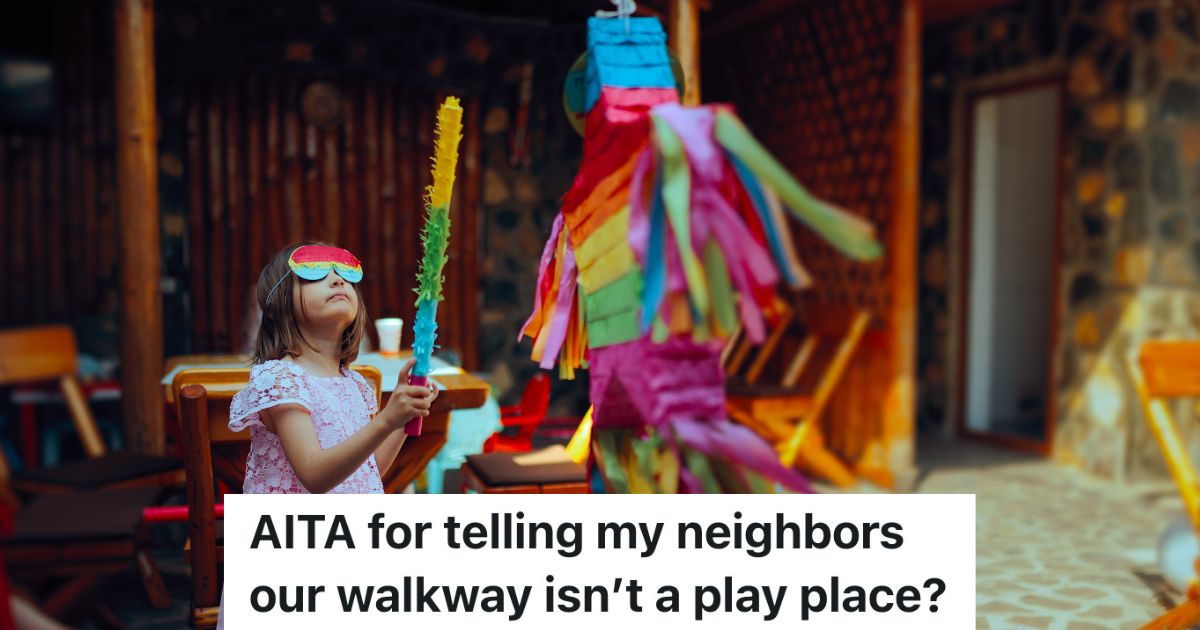 little girl hitting a pinata