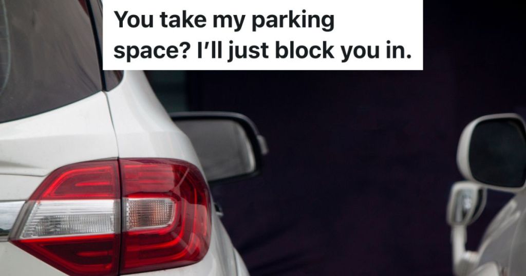 closeup from behind of two cars parked next to each other