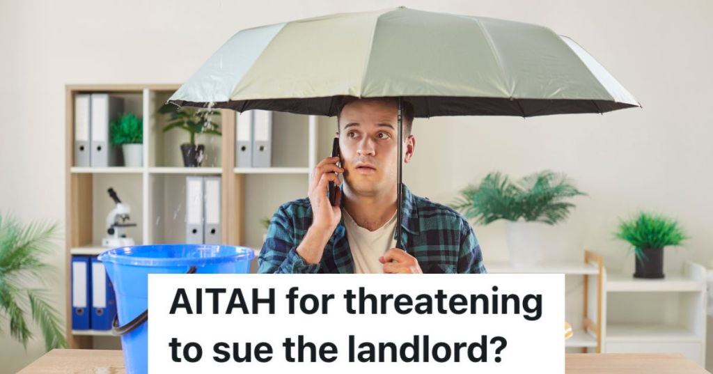 man holding umbrella inside while talking on phone