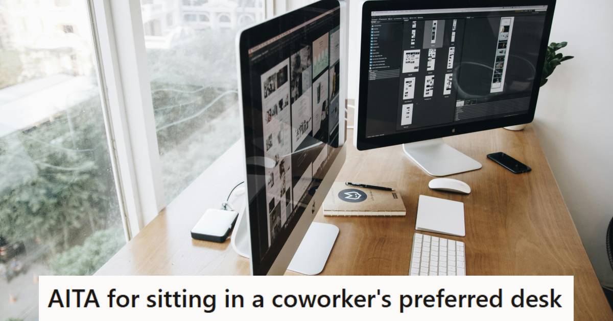 Mac Computer set up on a desk in front of a window