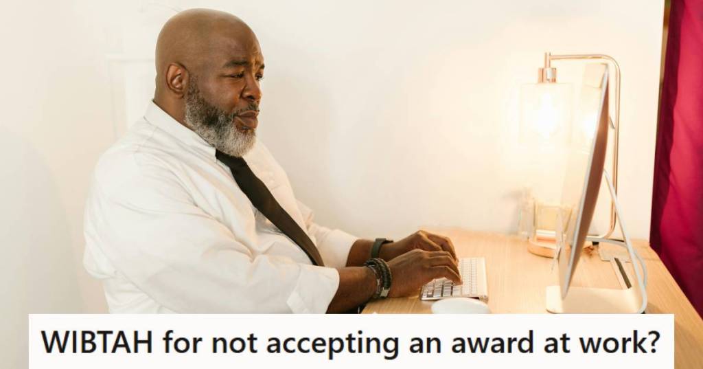 Man sitting at his computer, reading an email
