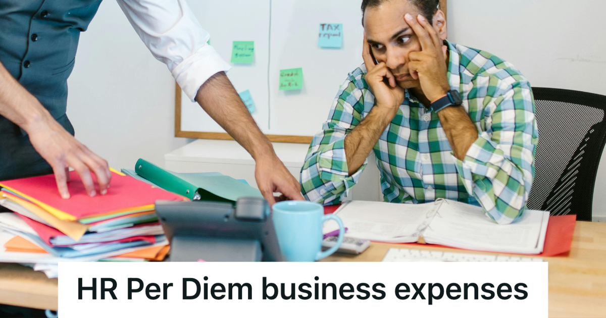 annoyed employee looking at a stack of paperwork