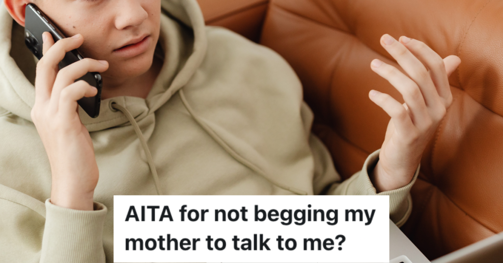 Teenage boy on the phone while sitting on couch.