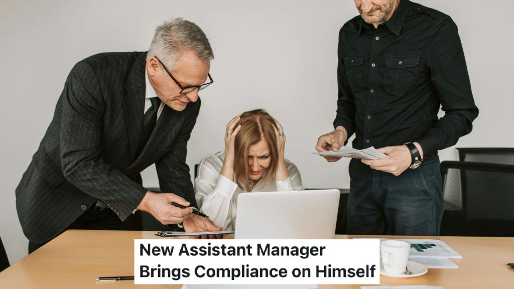 manager standing over frustrated employee