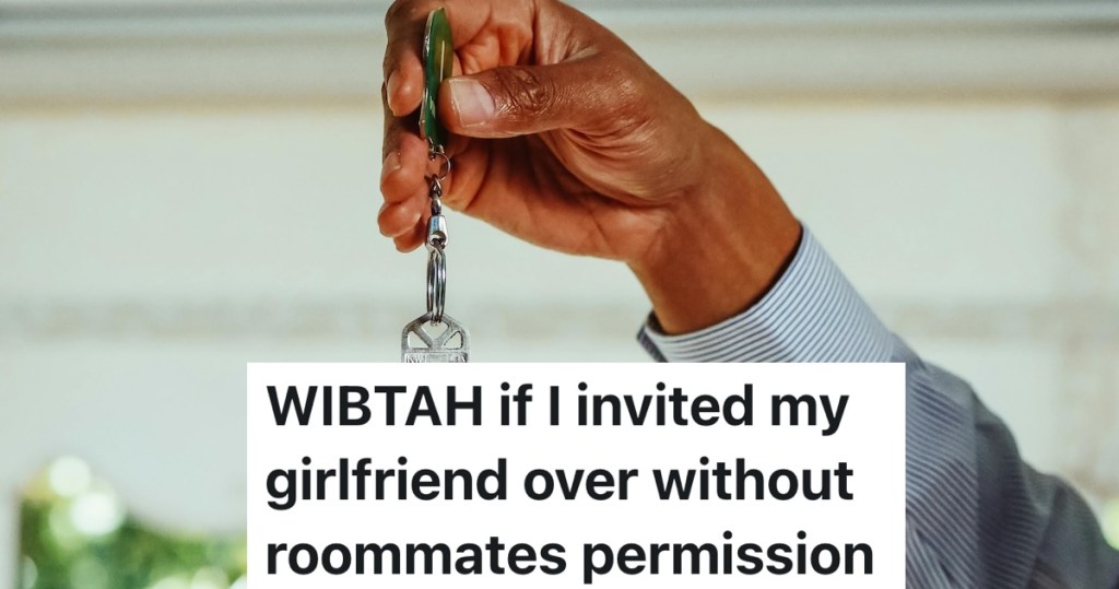 hand holding up an apartment key