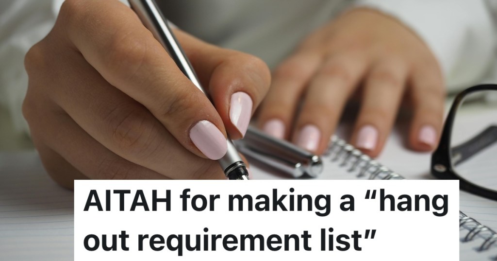 close-up of hands writing in a notebook with a pen
