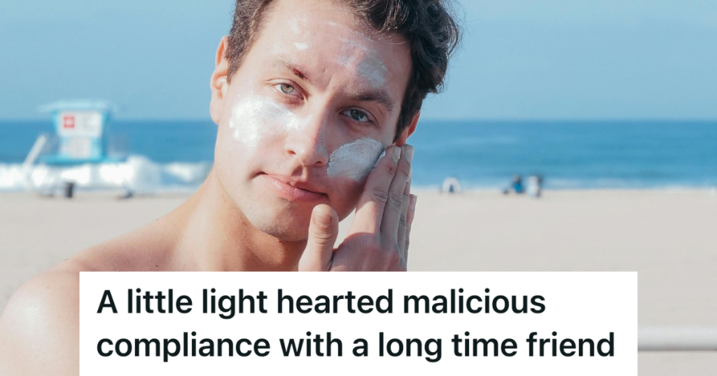 man applying sunscreen at the beach