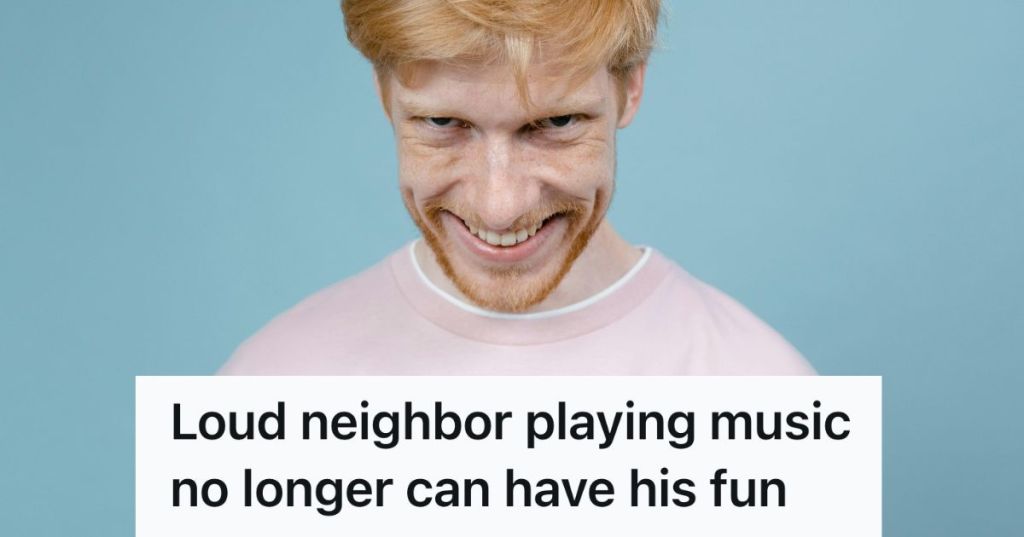 man grinning mischievously