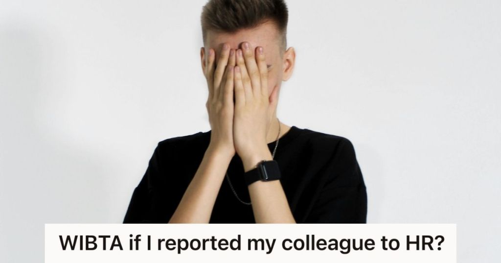 man in black shirt covering his face