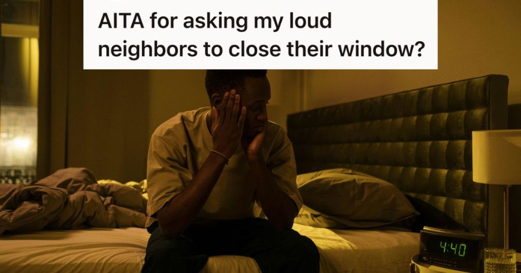 man laying awake looking at alarm clock