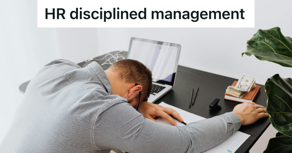 man sleeping at his desk