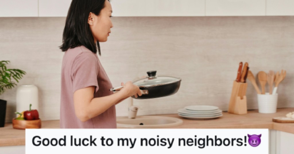 woman holding pan in her kitchen