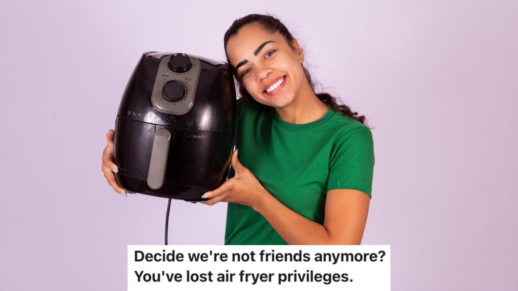 woman holding air fryer