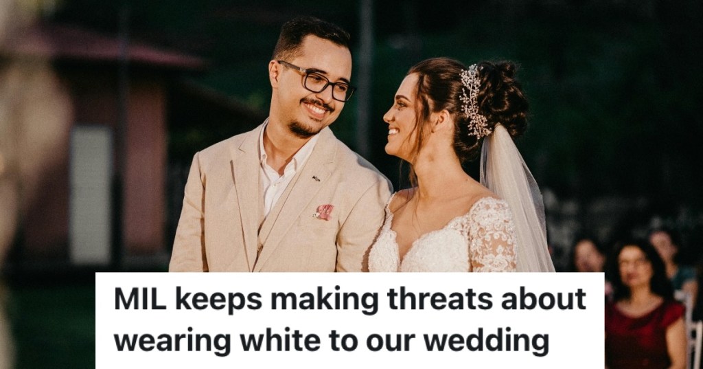 bride and groom smiling at each other