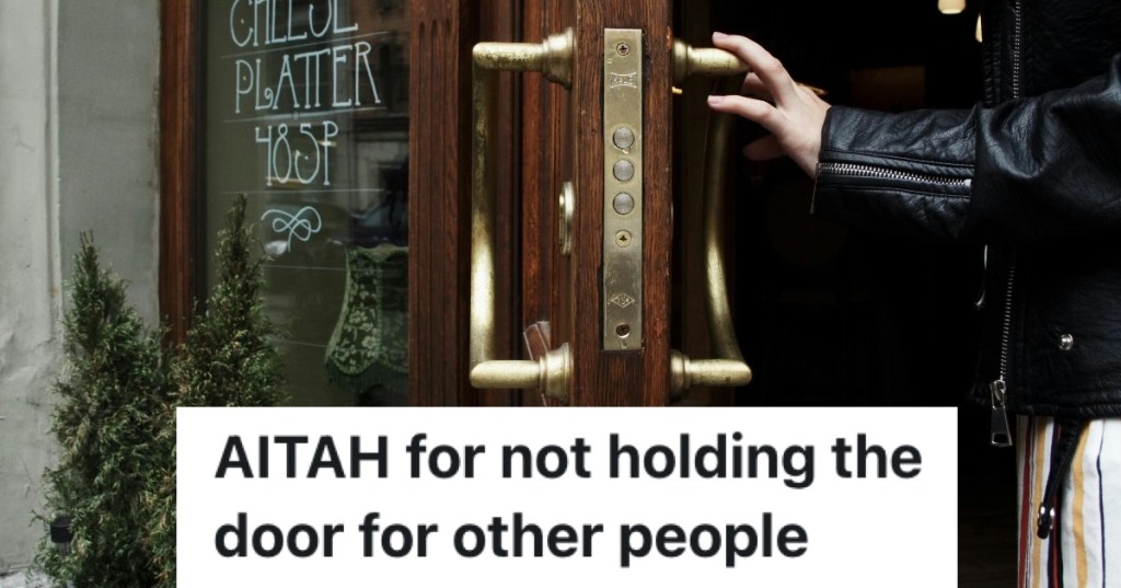 person opening business door