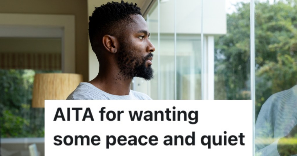 man looking out window