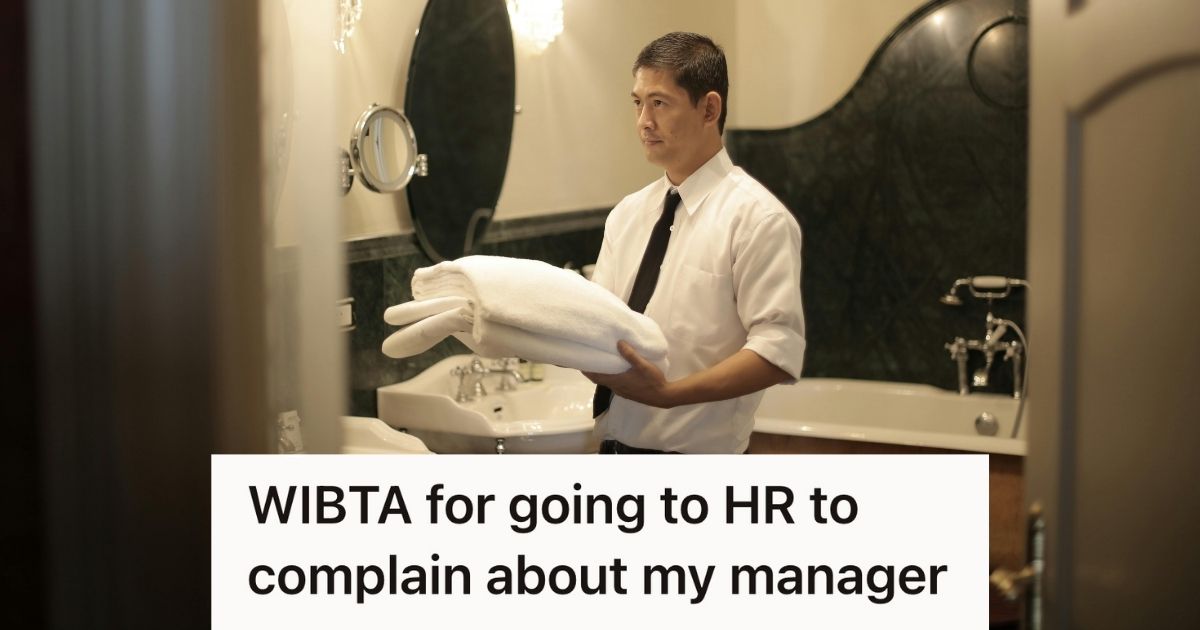 resort employee holding stack of towels