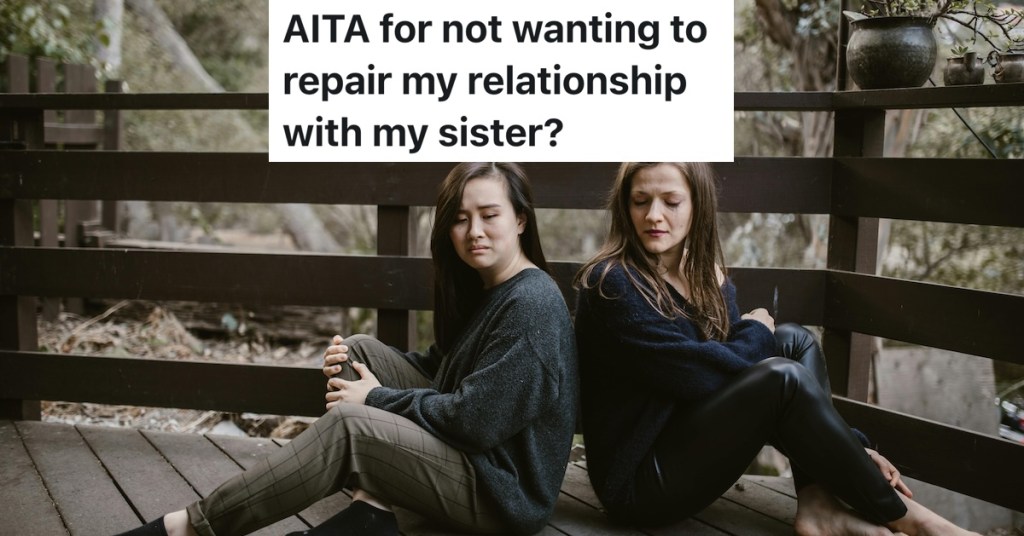 two women sitting back to back