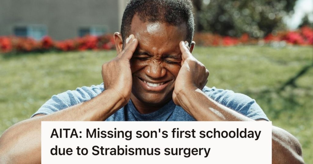 stressed man holding his temple