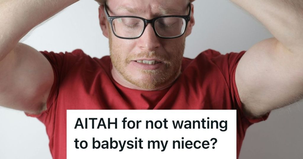 stressed man in red with hands over head