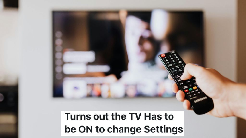 person using a remote to switch on television