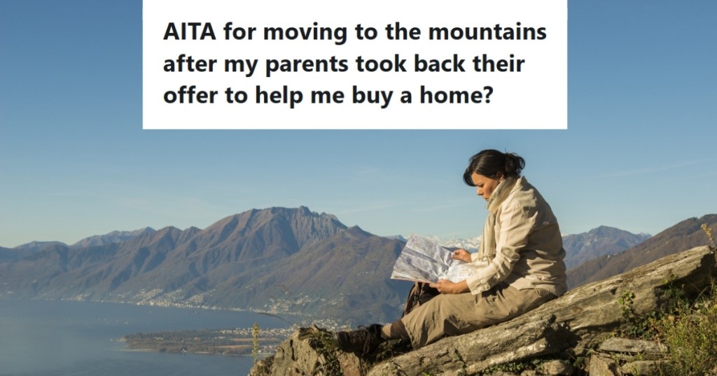 Woman at the mountains looking at map