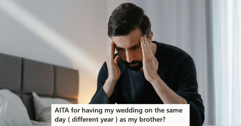 Man in black sweater sitting tensely